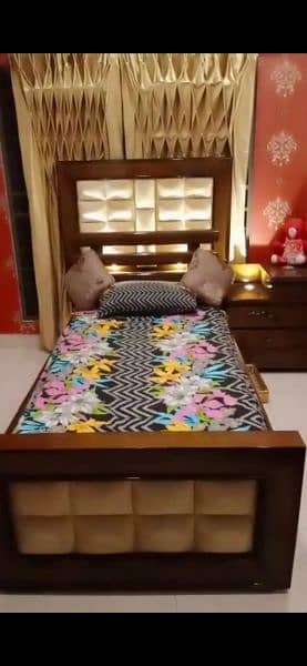 single bed with one side table 3