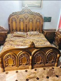 king size bed with two sides tables and one dressing