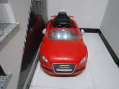 red Mercedes electric car for kids.