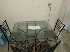 Glass table with 4 iron rod chairs