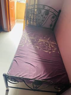single iron bed with mattress