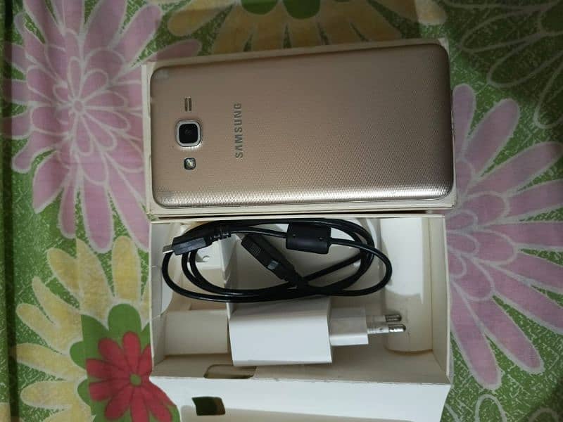 Samsung Galaxy grand prime+ with box and charger 1