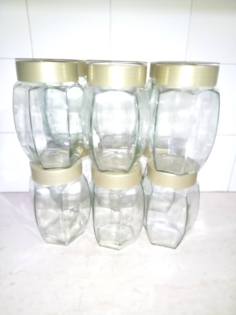 Glass jars with plastic lids 1Kg (Rs. 300 per pair) 1