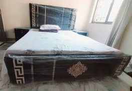 King size velvet Bed with side tables.