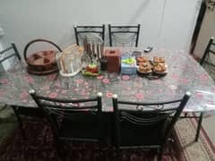 glass table with six chairs