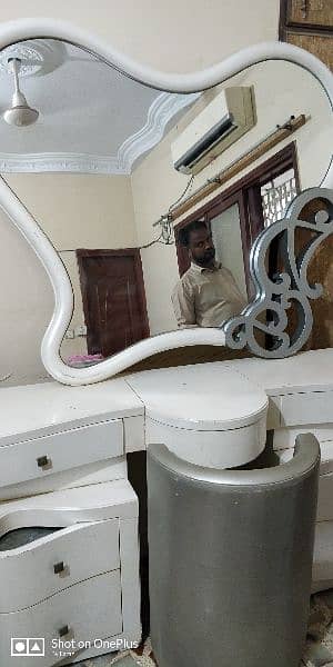 Dressing table with big size fancy mirror and a puffy chair 1