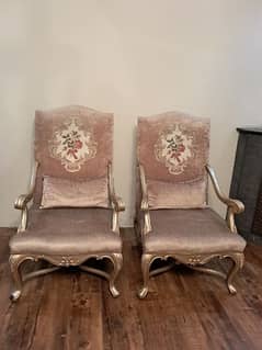 dull gold chairs pair