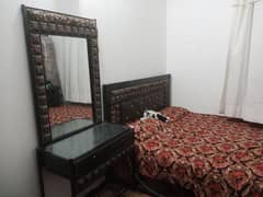 iron bed with dressing tabel