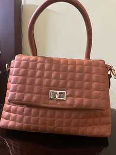 Caramel colored handbag