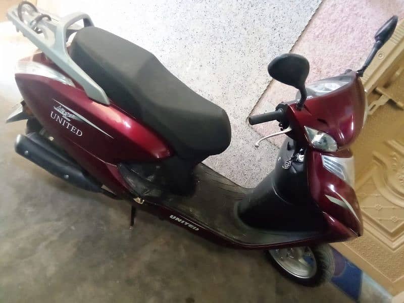 united 100 c scooty self n kick start 2