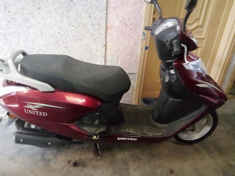 united 100 c scooty self n kick start 3