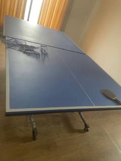 Table Tennis Table With Two Racquets and Net