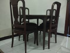 American dining table with four chairs . . .