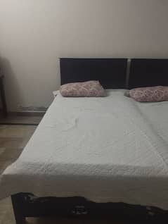 2 Single wooden bed