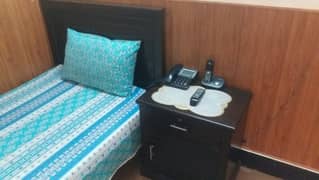 Single Bed along with one side table