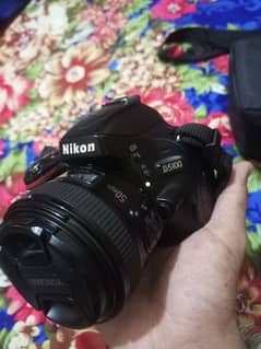 Nikon D5100 urgent sale full lush Condition 10/10with lens