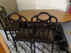 wooden dining table with chairs