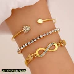 ladies bracelets / jewellery item / set of 3 golden bracelets