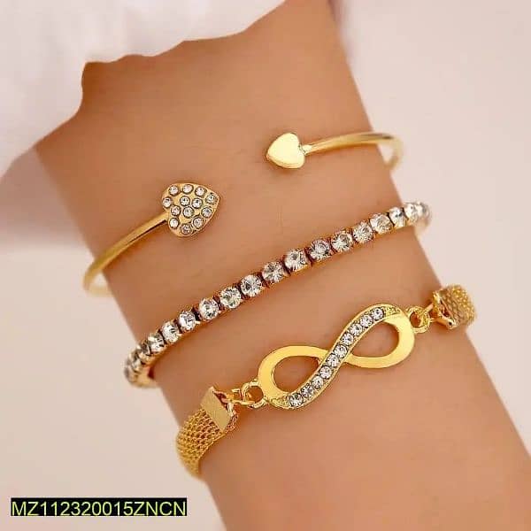 ladies bracelets / jewellery item / set of 3 golden bracelets 0