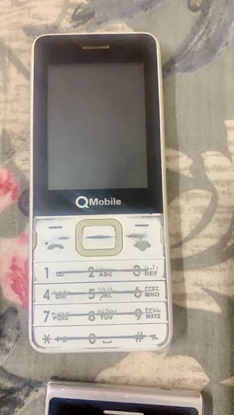 2 phone one is q mobile one is g five 1
