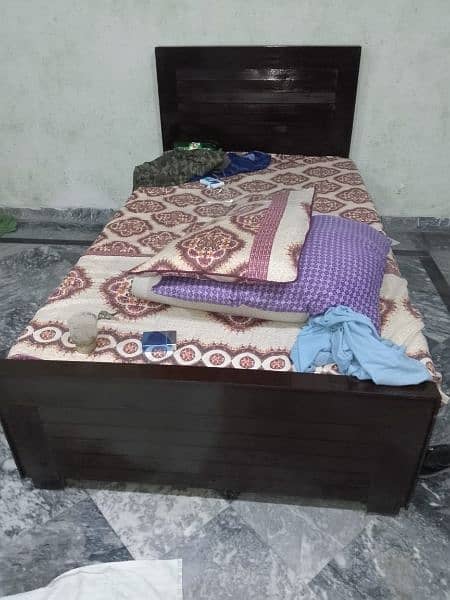 single bed with al Khair foam,  iron stand , wardrobe 1