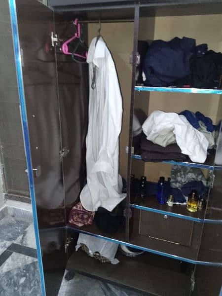 single bed with al Khair foam,  iron stand , wardrobe 5