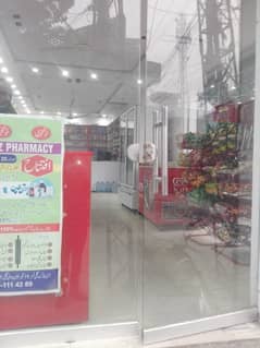 5 Marla Triple Story (Tax free zone) Commercial Property + Pharmacy Business For Sale Corner Plot Of Street Including Residential Flats Plus Running Business Of Pharmacy.