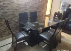 Dining table with 6 chairs just like new. light weight lasani