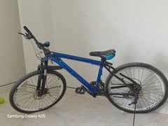 Shining blue bicycle for sale