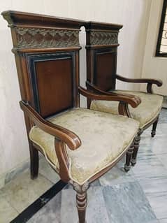 two chairs with a table