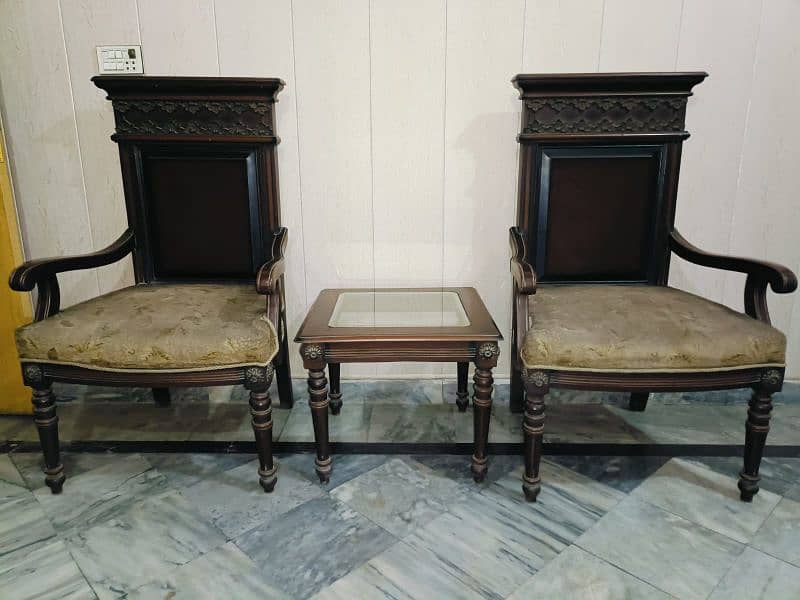 two chairs with a table 2