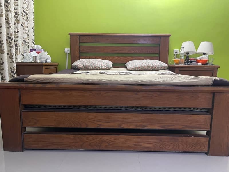 heavy wood bed with dressing and sidr tables 0