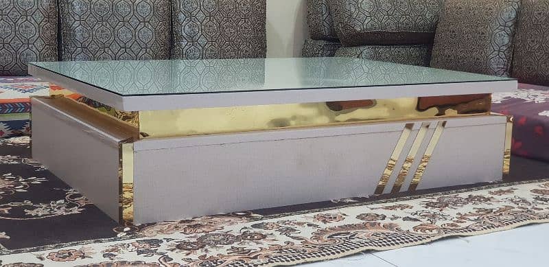 "Modern White Centre Table with Glass Top and Golden Accents for Sale" 0