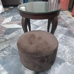 round table with round velvet stool