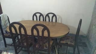wood dining table with six chare 0