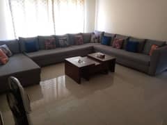 12 seater new condition sofa with center table
