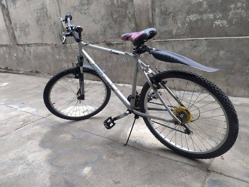 Mountain Bicycle with gears along air pump 0