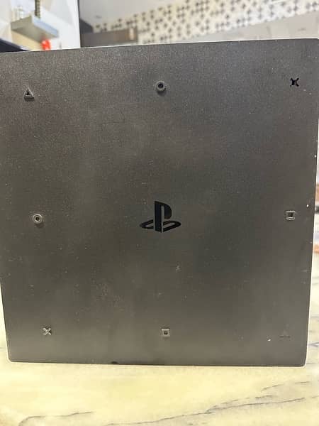 PS 4 pro 1 TB with two controllers 3