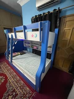 Bunk bed with cupboard