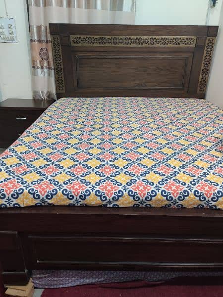 king size wooden bed with 2 side tables 1
