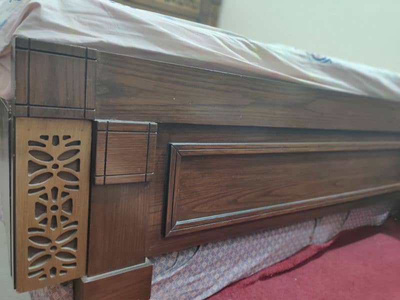 king size wooden bed with 2 side tables 8