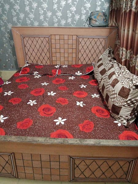 wooden double bed || condition good contact 2