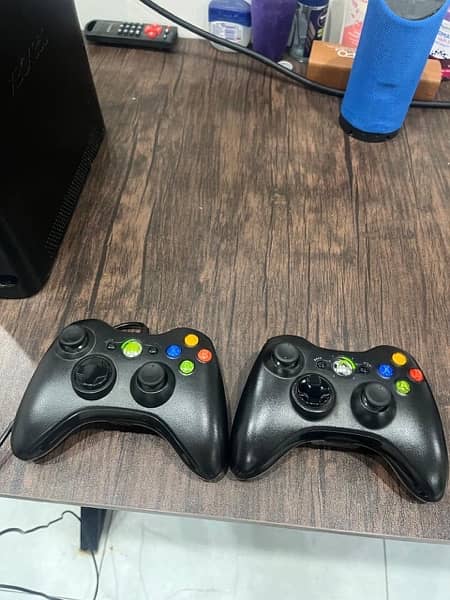 x box 360 with 2 controllers 1 is wire less or 1 with wire 1