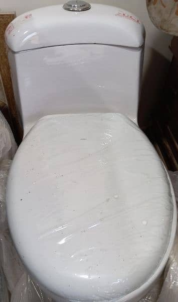 commode seat. white color. brand new 1
