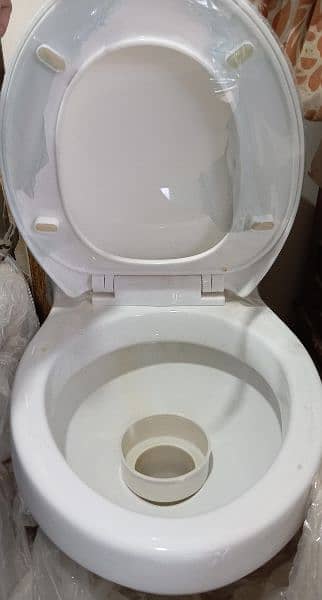 commode seat. white color. brand new 3