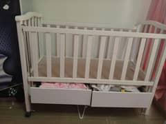 baby cot,baby gear made up of wood along with new mattress