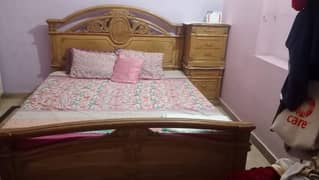 wooden bed with sidetables 0