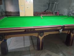 snooker table with balls and stick