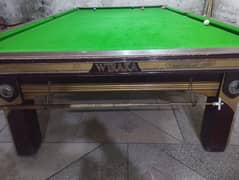 snooker table with balls and stick