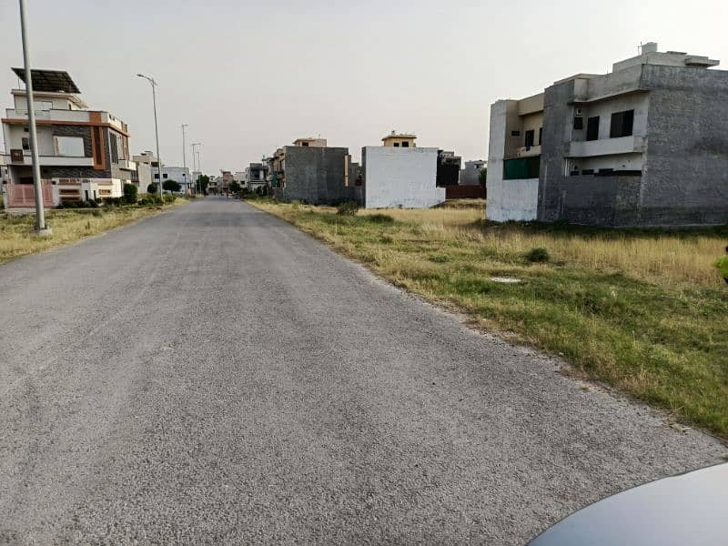 5 marla plot on 60 feet main road in C Block master city 1